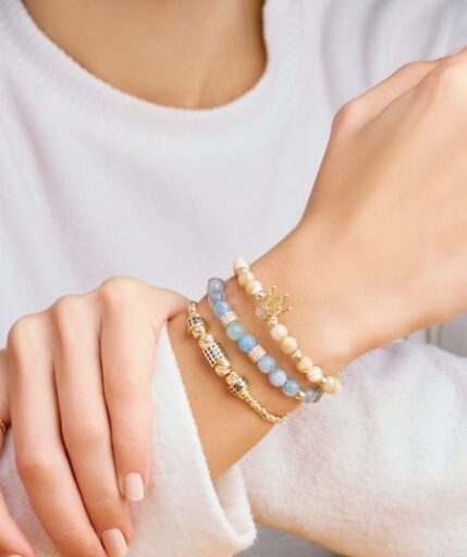 Crystal bracelets on left wrist